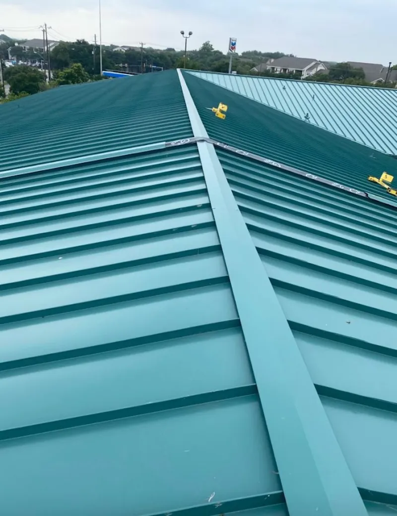 Green commercial metal roof ridge and valley for Metal Roof Repair in Horseshoe Bay